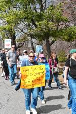 Protesters march along Mohawk Avenue in Sparta on Saturday, March 29. (Photo by Maria Kovic)