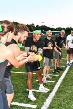<b>Participants pass wet sponges in a Bucket Brigade competition at an Adult Field Day on Aug. 22 in Vernon. (Photos by Maria Kovic)</b>