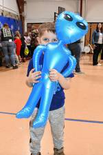 <b>Aiden Whitehead holds an inflatable alien toy at an Outer Space Jam event Wednesday, March 19 at Frankford Township School. (Photos by Maria Kovic)</b>