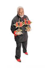 Magician Chris Capehart holds two trophies that he won on the TV show ‘Penn &amp; Teller: Fool Us.’ He will perform Saturday, June 15 in Sparta. (Photo provided)
