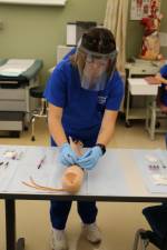 A student learns phlebotomy techniques in the Medical Assistant program. (Photo courtesy of Sussex County Community College)