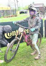 <b>Luisa Leonard gets her bike's tires filled with air.</b>