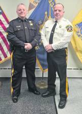 <b>Sussx County Sheriff Michael Strada, right, stands with retiring Cpl. Jason Kimble.</b>