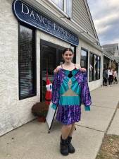 Leah Andrini holds up the costume that she will wear while performing in the 97th annual Macy’s Thanksgiving Day Parade on Thursday, Nov. 23. (Photo by Kathy Shwiff)