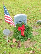 <b>The gravestone of Revolutionary War veteran Theodorus Polhemus in the Old Newton Cemetery is decorated as part of Wreaths Across America in December 2018. The gravestone was erected in October 2018 as part of a joint effort of the Daughters of the American Revolution, Sussex County Historical Society and Old Newton Cemetery Committee to locate and mark previously unmarked graves. Polhemus was born in Haverstraw, N.Y., and served as a corporal in the Orange County, N.Y., militia. He died in Newton in 1820. (Photo by Mandy Coriston)</b>