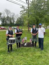 VN1 From left are Matthew, AJ and Alex McCann with Vernon Mayor Howard Burrell next to the 9/11 Survivor Tree seedling planted in front of the municipal building. (Photo by Daniele Sciuto)