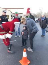 Brandon Kroen, 3, of Ogdensburg talks to Santa at the Sparta Station during the Operation Toy Train event Saturday, Dec. 10.