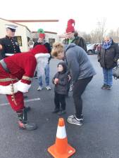 Brandon Kroen, 3, of Ogdensburg talks to Santa at the Sparta Station during the Operation Toy Train event Saturday, Dec. 10.