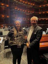 Leigh Rose Hart of Vernon stands with her conductor, James Miller of Tenafly High School, on Nov. 20 at the New Jersey Performing Arts Center in Newark.
