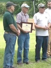 Elmer Platz receives recognition for his work in forest management.