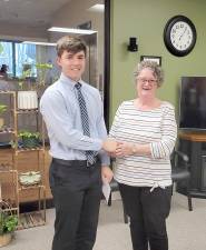 Matthew Rogers is presented with a check from VTRO President Jill DeYoung.