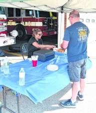 <b>Mike Smith of Vernon is served his food.</b>