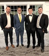 <b>Vernon Township High School senior Luca Vizzini represents the school at the annual Greater Morris County Football Chapter Scholar Athlete Dinner. From left are assistant coaches James D’Alessio and Scott Schiller, Vizzini and head coach Steve Down. (Photo provided)</b>