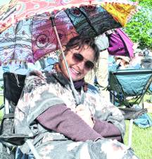 <b>Rebecca Pitras of Montague shades herself with an umbrella.</b>
