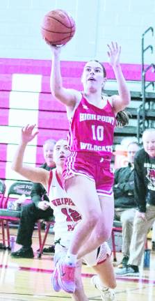 <b>High Point's Abigail Amick leaps during a shot.</b>