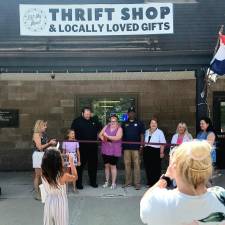 Julie Gay cuts a ribbon for the opening of a new location for Lift My Mood Thrift Shop &amp; Gifts. From left are Stephanie Scilingo, president of the Vernon Chamber of Commerce; Scilingo’s granddaughter Ava LaMantia; Edward and Julie Gay; Mayor Howard Burrell; Councilwoman Peg Distasi; mayoral candidate Sally Rinker; and Jen Lubliner of the Vernon Chamber. (Photo provided)
