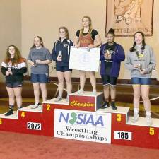 Caitlin Hart on the podium (far right) after placing fifth at the State Tournament (Photo provided by Ashley Iliff)