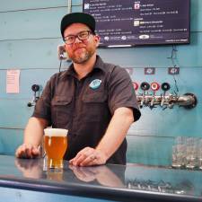 Apex Brewery’s David Holm behind the bar. Photo provided.