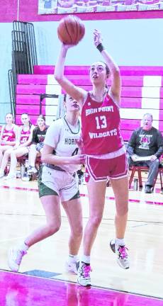 <b>High Point's Brooke Wagner (13) leaps during a shot. Wagner scored 12 points.</b>