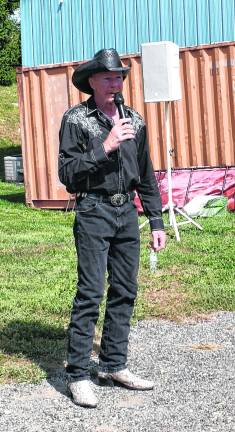 <b>A cowboy sings during the karaoke competition.</b>
