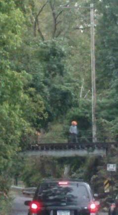 Photo courtesy of Facebook Photos of a seemingly armed clown on the bridge over Walsh Rd. on the Newburgh/New Windsor border in Orange County, N.Y. circulated Facebook over the weekend.