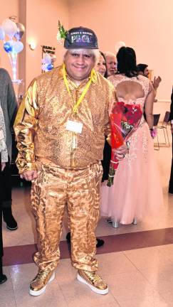 <b>Martin Springer poses in a gold suit.</b>