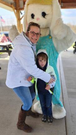 Kim Sidoti and her son Kaden, 5, pose with the Easter Bunny in Wantage.