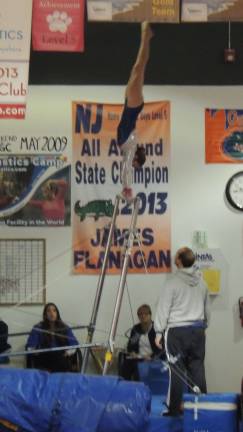 Dara DePaolo of Wantage performs on the uneven bars.