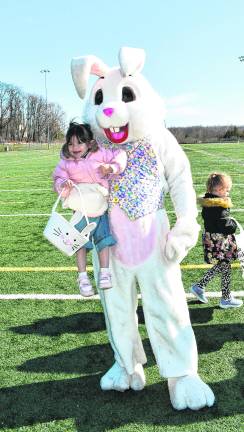 <b>The Easter Bunny holds Anas Swailmyeen of Vernon.</b>