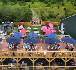 Tin Barn renovated its outdoor space last summer, adding a stage for live music, a two-story deck, and more outdoor seating. Photo provided.