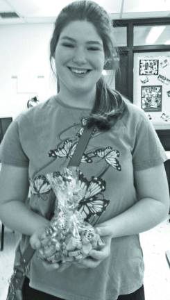 Rebecca Hill of Vernon, shows a bag of the dog biscuits she and her class made.