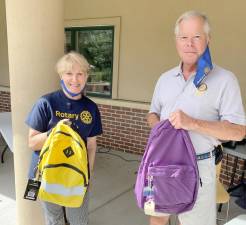 Elenora Benz and Mike Dolan donated new backpacks to Project Self-Sufficiency last year.