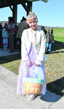 <b>Little Miss Wantage Annika GeBauer holds a basket.</b>