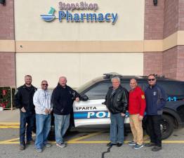 Officer Brian Porter, Corporal Mark Mastandrea, and Corporal Scott Elig of the Sparta Police Department, with Eric Nielsen of Frankin Sussex Automall, Mohawk House’s Steve Scro, and Sparta Police Chief Neil Spidaletto at the Sparta Stop &amp; Shop’s Cram the Cruiser food drive. “There are so many people that go hungry every day, that is so sad,” said Nielsen. “I am happy that we cold help some of them have food on their table every day, not just Thanksgiving.”
