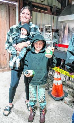 MS5 Kate Garrison with baby Michael and Ryder, who holds containers of fresh maple syrup sold at the historic farm.