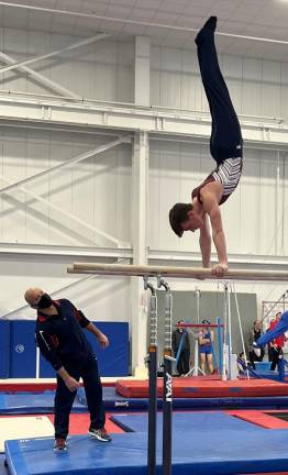 Vernon's Colin Duffy competes on the balance bar.
