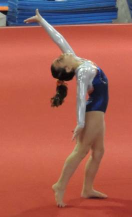 Jadyn DePaolo of Wantage finishes her floor routine.