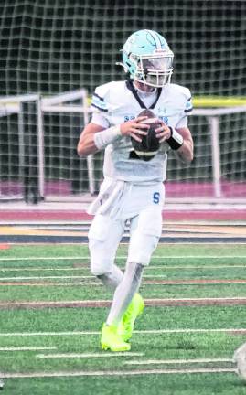 <b>Sparta quarterback Jameson Lewis (center) threw one touchdown pass.</b>