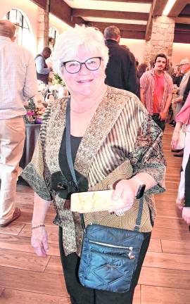 Peg Mullins of Frankford poses for a photo with her food.