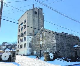 The 1924 concrete mill, including the 90-foot tower/grain silo, on Gingerbread Castle Road just off Route 23 in Hamburg is being demolished. The owner also began demolition of the shorter office tower - without permission. A stop-work order was issued until it is determined what can be saved, stabilized and how. (Photo provided)