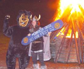 MC mascot Vern and Nordic God Ullr celebrate the upcoming ski season at the Ullr Fest bon fire.