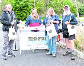 <b>Karl Hafner of Sussex, Liz Rockwell of the Altered Course Store, Kathy Drost of Sussex and Artie Grimes of Franklin pose with Sussex Market shopping bags.</b>