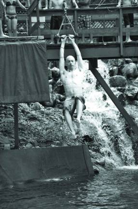 Vernon resident Jake Varvarovsky enjoys his season pass as he flies through the air on his way into the water below on the ìTarzan Swingsî attraction. It is one of his favorite on the mountain.Mountain Creek Water Park is now open for the season. With over 47,000 Face Book ìLikesî the resort expects another great season. Season passes, corporate packages and group rates are available.