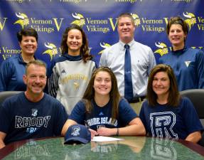 Seated left of Franki Potocki is Father Ken and seated right is mother Tracy.Standing left to right: Assistant Coach Mandy Hofmann, Assistant Coach Dominique Ocello, Athletic Director Bill Foley and Head Coach Kerry Ludeking