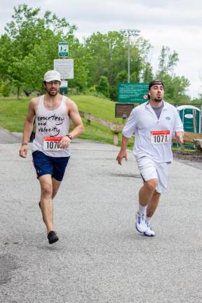 Eric, left, and Michael Rossi of Glenwood approach the finish line. They finished the 5K in less than 30 minutes.