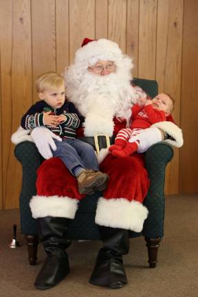 Michael and Dylan Conover of Wantage pose with Santa
