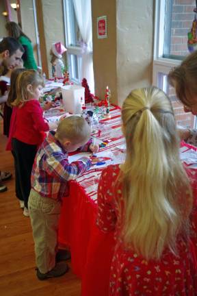 Hard at work at the children&#xed;s craft table.