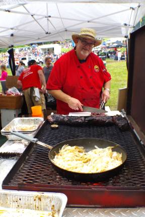 Chef Dan Lemire of Chumleys BBQ and Catering in Florida, NY, is shown cooking up some ribs.