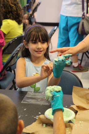 Madison Salerno of Wantage creates Gooey Gunk at the Sussex Wantage Library.