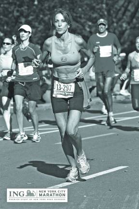 Laura DeLea, captain of Team Eastern in Sparta, running in the NYC Marathon.